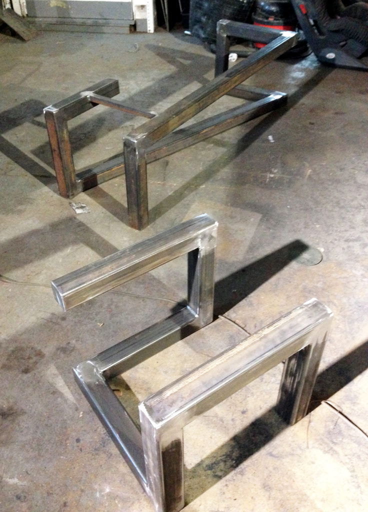 Steel bench bases. Fitted with green oak seats that weather over time.